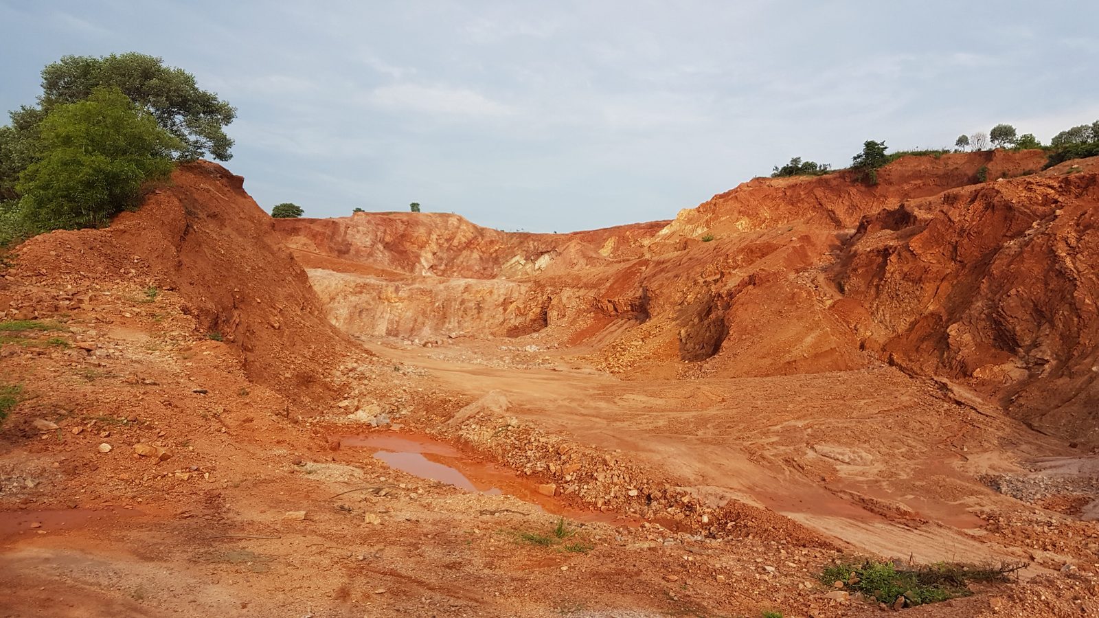 An open quarry cut into red earth near Kothavalasa, Andhra Pradesh