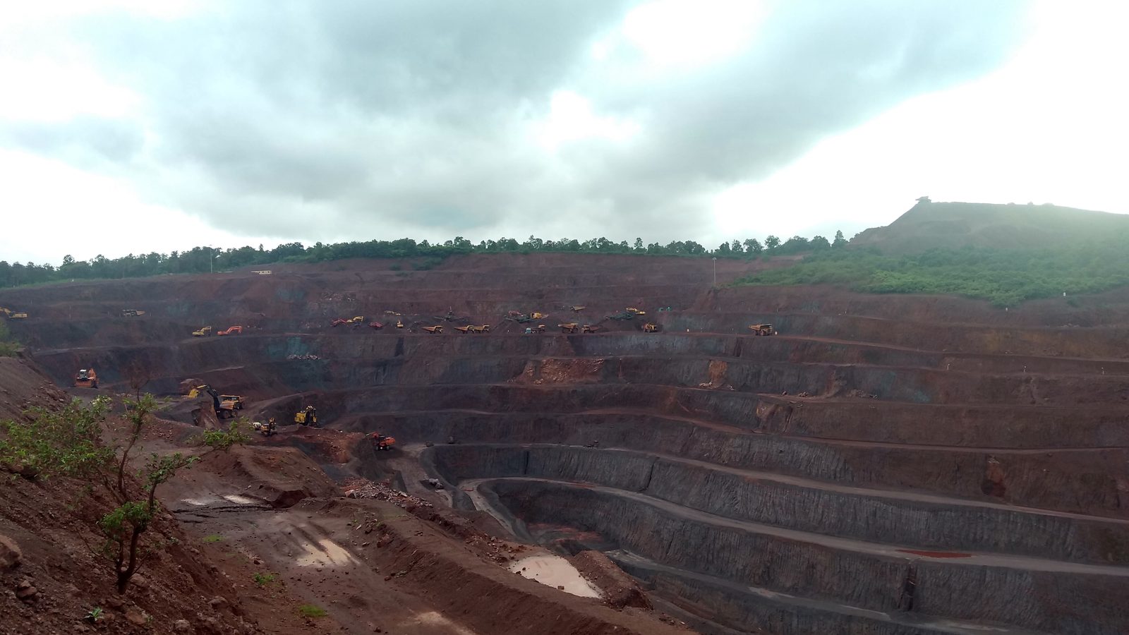 Benched terraces of an open-pit iron ore mine in Keonjhar district, Odisha